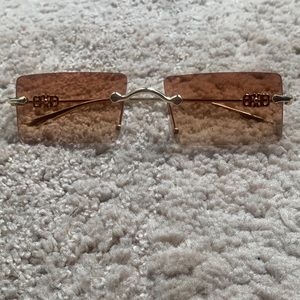 Rimless square frame sunglasses.